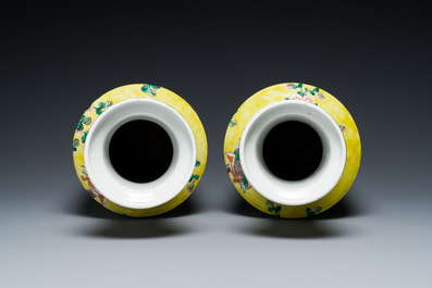 A pair of Chinese yellow-ground famille verte rouleau vases, 19th C.