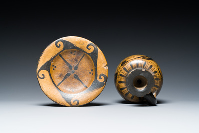 An Etruskian 'aryballos' portrait ewer and a 'patera' dish with black geometrical design, 4th C. b.C.