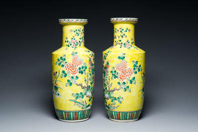A pair of Chinese yellow-ground famille verte rouleau vases, 19th C.