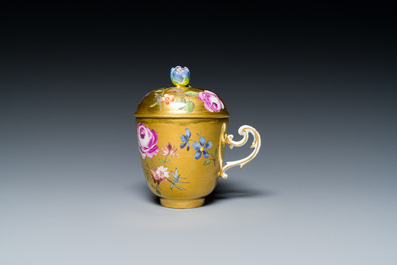 A polychrome gilt-ground Meissen porcelain cup and cover, Germany, 18th C.