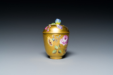 A polychrome gilt-ground Meissen porcelain cup and cover, Germany, 18th C.