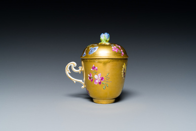 A polychrome gilt-ground Meissen porcelain cup and cover, Germany, 18th C.