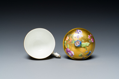 A polychrome gilt-ground Meissen porcelain cup and cover, Germany, 18th C.