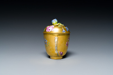A polychrome gilt-ground Meissen porcelain cup and cover, Germany, 18th C.