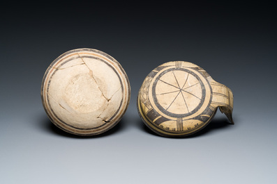 A polychrome Greek pottery 'oinochoe' ewer and a geometrically decorated Daunian pottery bowl, Southern Italy, 6th/3rd C. b.C.