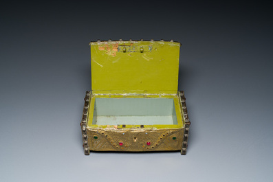 Alfred Daguet (Paris, 1875-1942): A Gothic revival repouss&eacute; brass and copper-mounted metal box with glass cabochons, dated 1907
