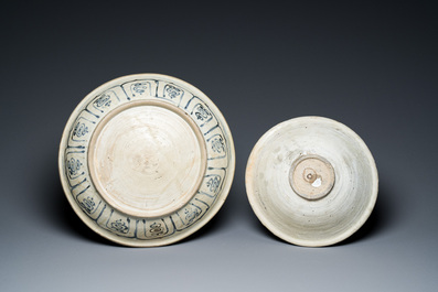 A Vietnamese or Annamese blue and white dish, a Thai Sawankhalok dish and a pair of celadon figures, 14th C. and later