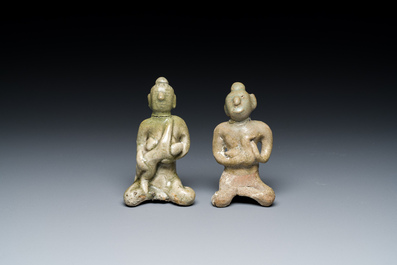 A Vietnamese or Annamese blue and white dish, a Thai Sawankhalok dish and a pair of celadon figures, 14th C. and later