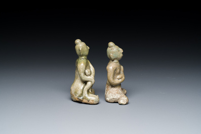 A Vietnamese or Annamese blue and white dish, a Thai Sawankhalok dish and a pair of celadon figures, 14th C. and later