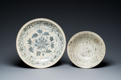A Vietnamese or Annamese blue and white dish, a Thai Sawankhalok dish and a pair of celadon figures, 14th C. and later