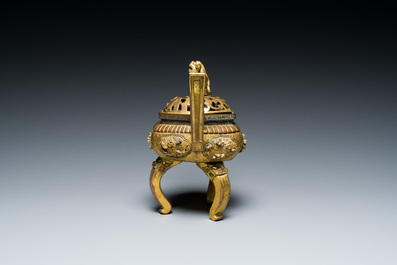 A Chinese gilt bronze tripod censer, 18/19th C.