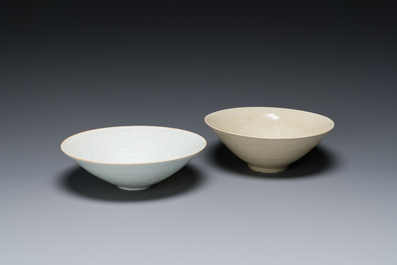 A Chinese qingbai-glazed 'phoenixes' bowl and a cream-glazed 'fish' bowl, probably Song
