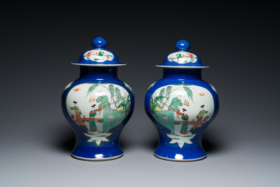 A pair of Chinese powder-blue-ground famille verte vases and covers, 19th C.
