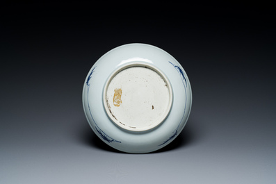 A Chinese blue and white dish with a scholar in a landscape, Yongzheng/Qianlong