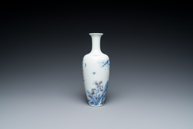 A Chinese blue, white and copper-red 'magpie and prunus' vase, Kangxi mark, 19/20th C.