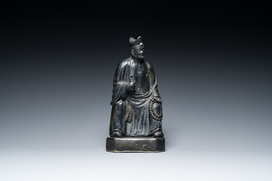 A Chinese monochrome black-glazed figure of Ji Gong, 18th C.
