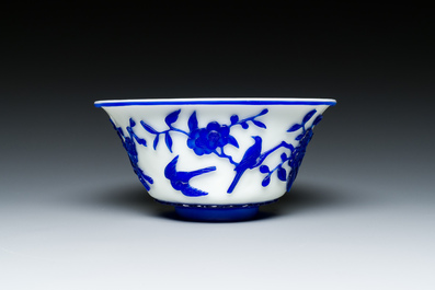 A Chinese overlay Beijing glass 'magpie and plum blossom' bowl in blue on white, 19th C.