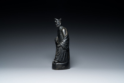 A Chinese monochrome black-glazed figure of Ji Gong, 18th C.