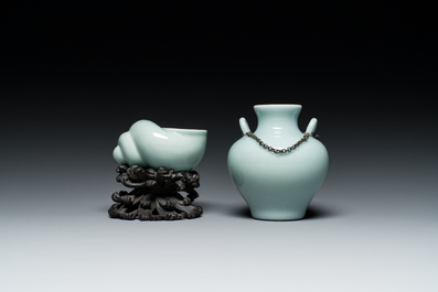 A Chinese celadon-glazed water pot on wooden stand and a small 'hu' vase, 19/20th C.