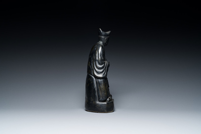 A Chinese monochrome black-glazed figure of Ji Gong, 18th C.