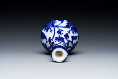 A Chinese overlay Beijing glass bottle vase with lotus scrolls in blue on white, 19th C.
