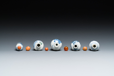 Five Chinese blue, white and wucai snuff bottles, 19th C.