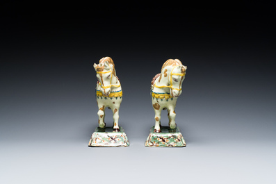 A pair of polychrome Dutch Delft standing horses, 18th C.