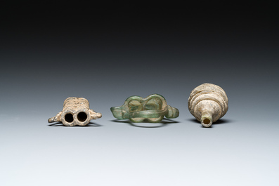 Two Roman glass balsamariums and a flask, 2nd/4th C.