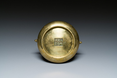 A Chinese bronze elephant-head-handled censer, Xuande mark, Kangxi/Qianlong