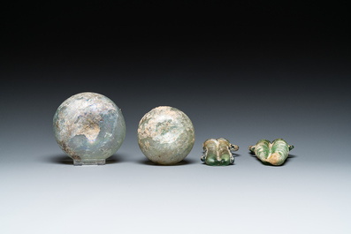 Two Roman glass balsamariums, a flask and a bowl, 2nd/4th C.