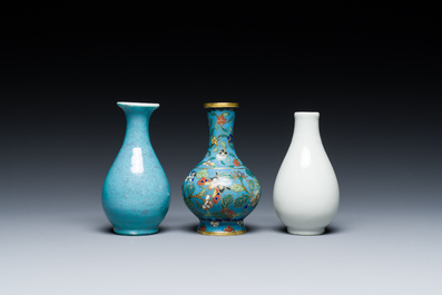 Three small Chinese bottle vases in cloisonn&eacute;, white and robin's-egg-glazed porcelain, 19/20th C.