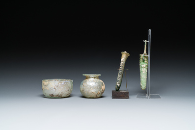 Two Roman glass balsamariums, a flask and a bowl, 2nd/4th C.