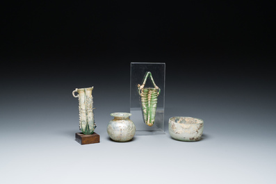 Two Roman glass balsamariums, a flask and a bowl, 2nd/4th C.