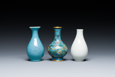 Three small Chinese bottle vases in cloisonn&eacute;, white and robin's-egg-glazed porcelain, 19/20th C.