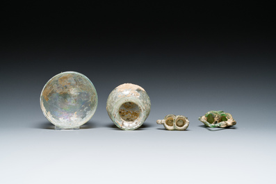 Two Roman glass balsamariums, a flask and a bowl, 2nd/4th C.