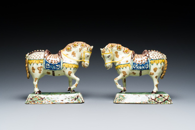 A pair of polychrome Dutch Delft standing horses, 18th C.