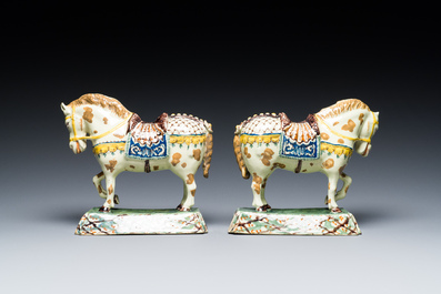 A pair of polychrome Dutch Delft standing horses, 18th C.