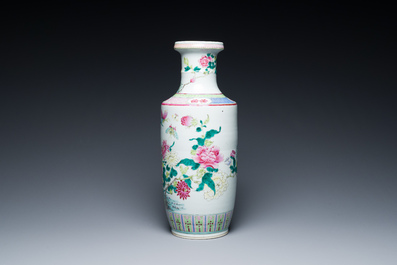 A Chinese famille rose rouleau vase with a parrot among blossoming branches, 19th C.