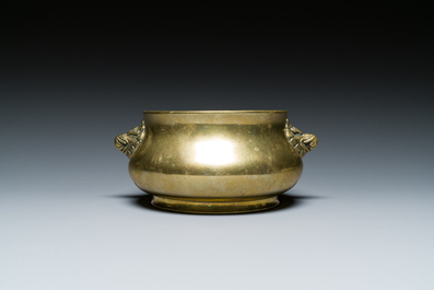 A Chinese bronze elephant-head-handled censer, Xuande mark, Kangxi/Qianlong