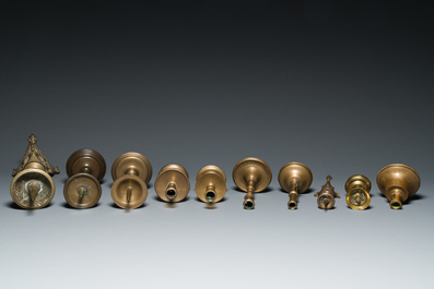 A varied collection of ten brass and bronze candlesticks, Western Europe, 15th C. and later