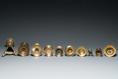 A varied collection of ten brass and bronze candlesticks, Western Europe, 15th C. and later