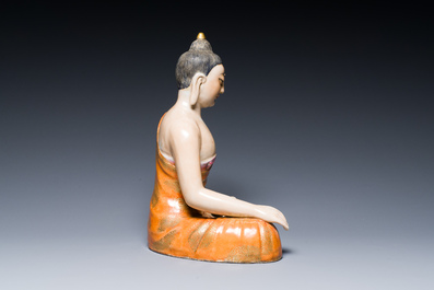 A Chinese famille rose figure of Buddha, Qianlong mark, 19/20th C.