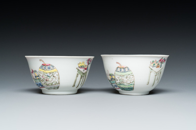 A pair of Chinese famille rose cups and saucers with a lady and a boy, Yongzheng