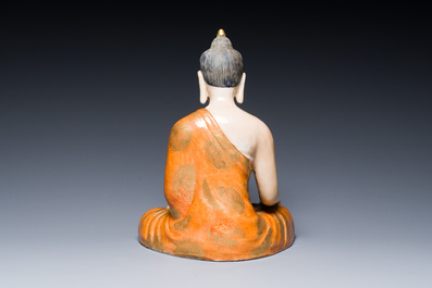 A Chinese famille rose figure of Buddha, Qianlong mark, 19/20th C.