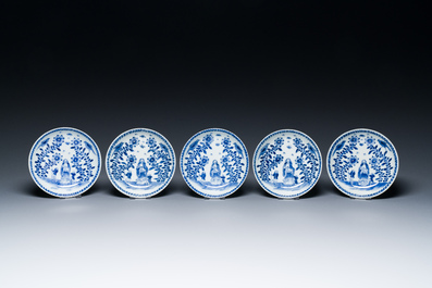 Nine Chinese blue and white 'Madonna and Child' saucers and two cups, Kangxi