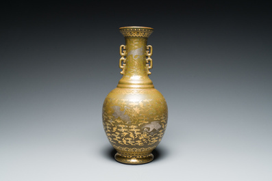 A Chinese gilt- and silver-decorated teadust-glazed vase with bats and cranes among clouds, Qianlong mark, Republic