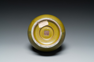 A Chinese monochrome teadust-glazed 'hu' vase, Qianlong mark, 19/20th C.