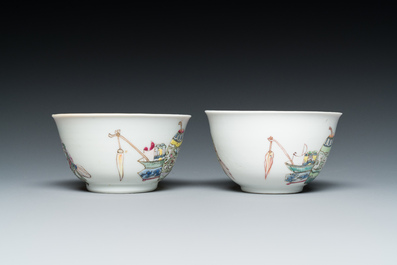 A pair of Chinese famille rose cups and saucers with a lady and a boy, Yongzheng