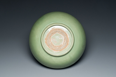 A Chinese Longquan celadon bowl with underglaze floral design, Ming