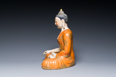 A Chinese famille rose figure of Buddha, Qianlong mark, 19/20th C.